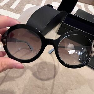 Prada Sunglasses.